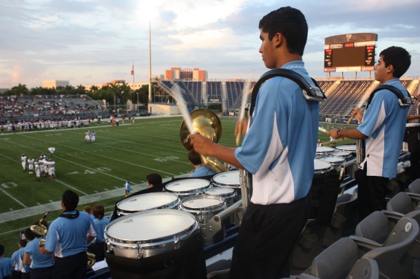 Junior Alexander Perez plays alongside fellow drum-liners at a football game. Perez always enjoys watching the scene from up above. “High school seems so great while standing up in the bleachers,” Perez said.