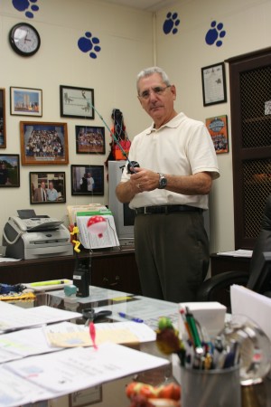 READY TO RELAX: Surrounded by memories of his tenure at Palmetto, Principal Howard Weiner prepares for retirement as he pulls out his fishing pole in his office. Weiner was principal of Palmetto for six years. “The goal I’ve achieved is maintaining the level of academic excellence that this school has maintained for 50 years,” Weiner said, “and I feel I’ve done everything in my power to maintain that tradition.”