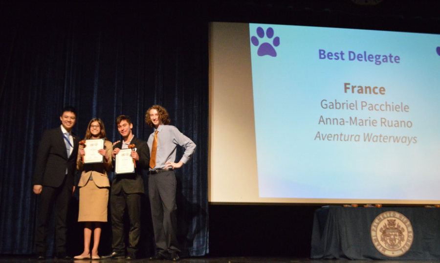 Le gagnant est. . . Delegates Anna-Marie Ruano (second from left) and Gabriel Pacchiele (third from left) representing France won Best Delegate for the Security Council.  Dedication and teamwork truly pay off with this pair.