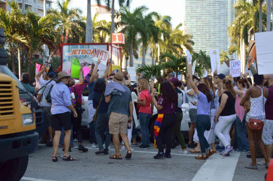 Over ten thousand marchers pour into the streets, blocking traffic.