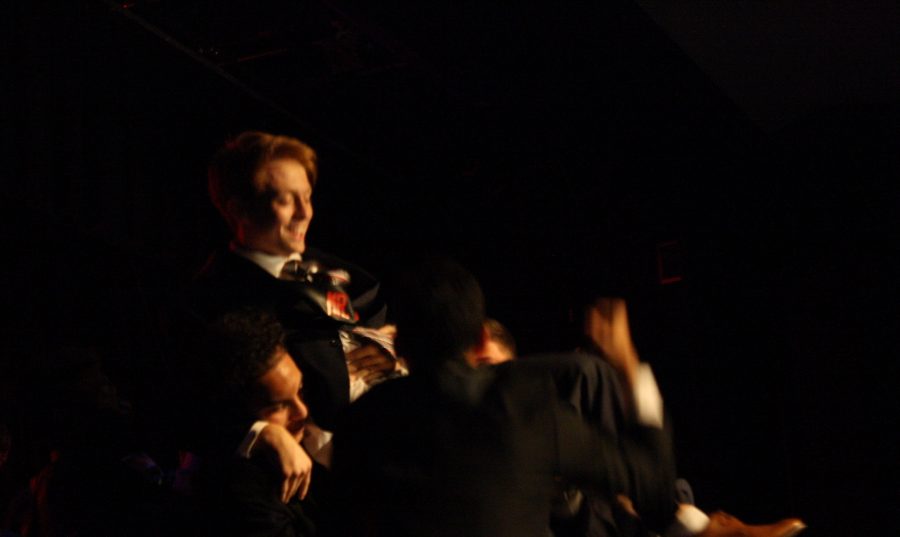 Mr. TVP wins Mr. Panther and the other contestants lift him up and cheer him on.