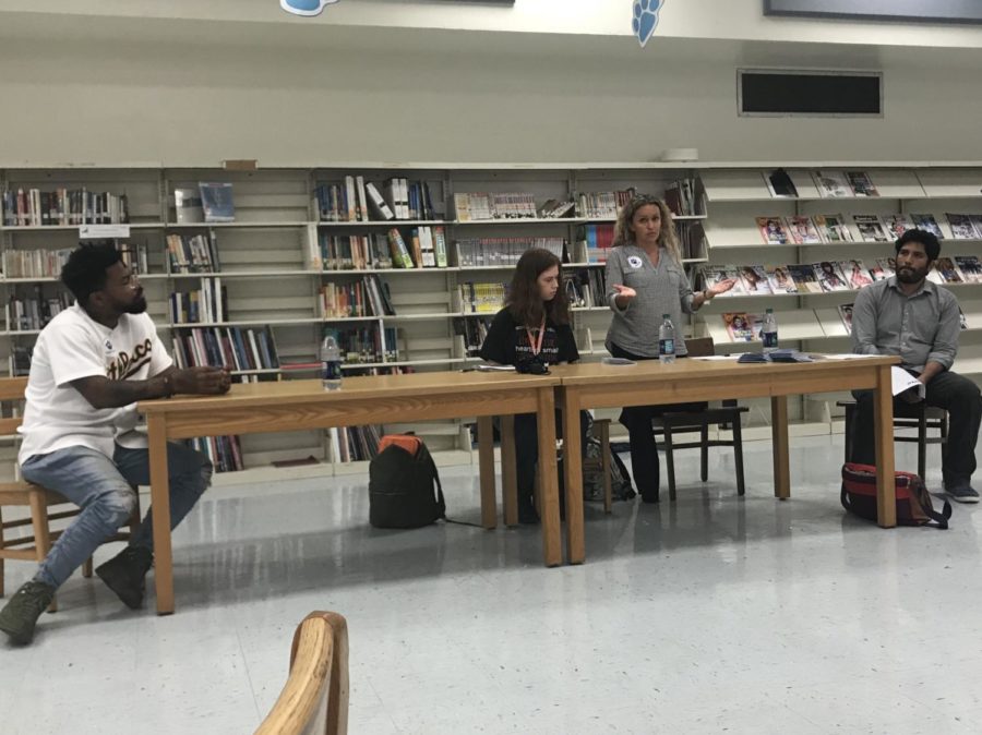 (from left to right) Phillip Agnew, Nicole Markus, Monica Espitia and Juan Cuba lead a discussion about how to protest effectively at a meeting on March 7 after school in the media center. Students have organized a walkout for March 14 at 10:00 a.m.