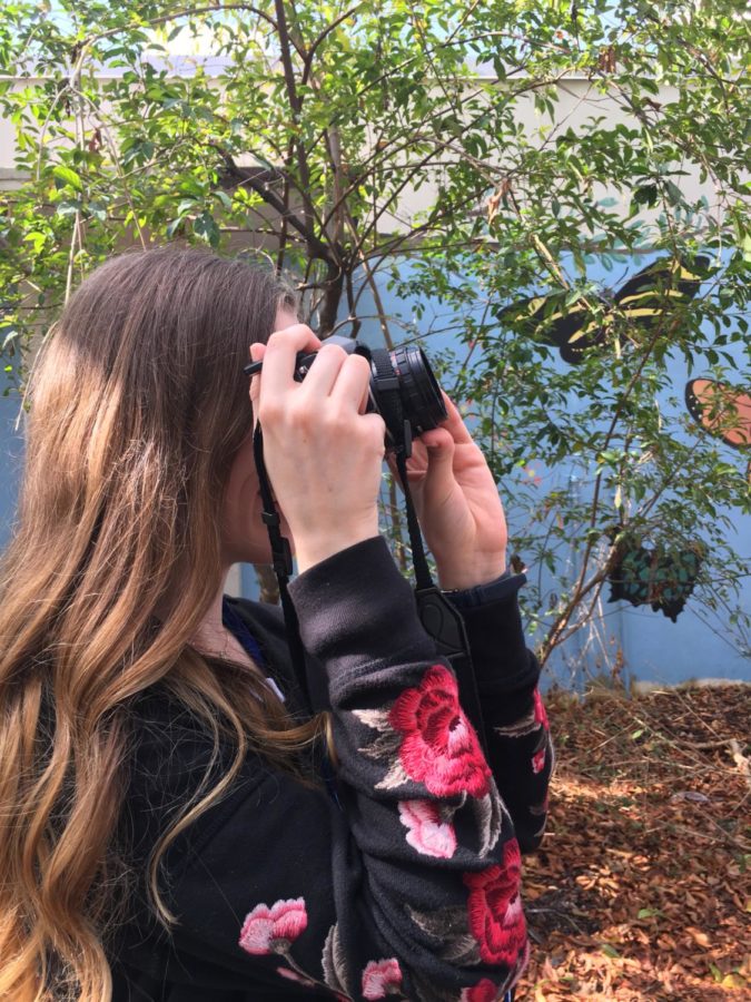 Brooke Brown adjusts her settings before taking a photo. 
