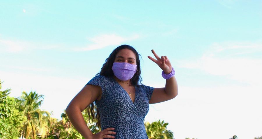Senior Miriam Gomez wears her hand-made, lavender gingham face mask.