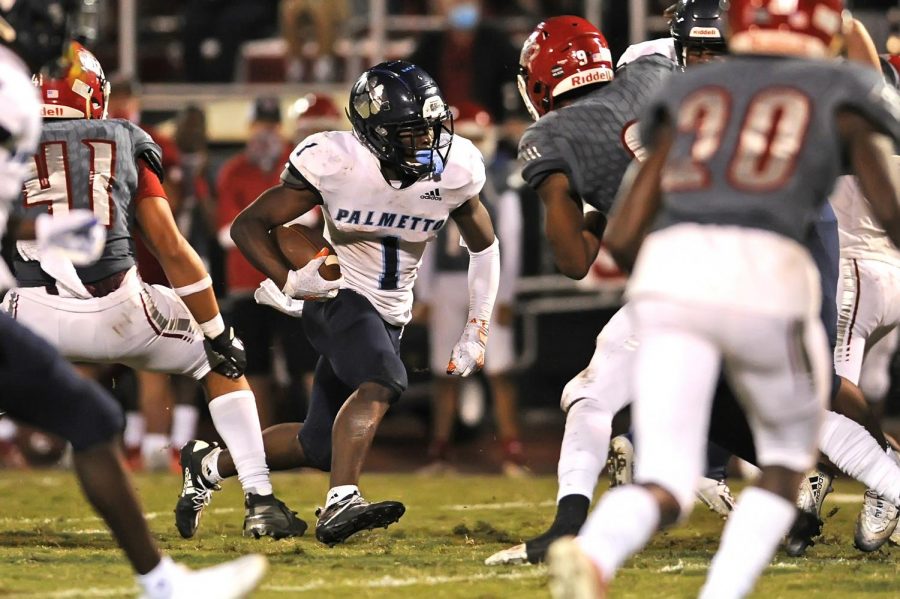 Palmetto wide receiver Brashard Smith runs through the defense en route to a 10-7 victory against Vero Beach. (Photo courtesy of Matthew Lewis/ImageReflex)