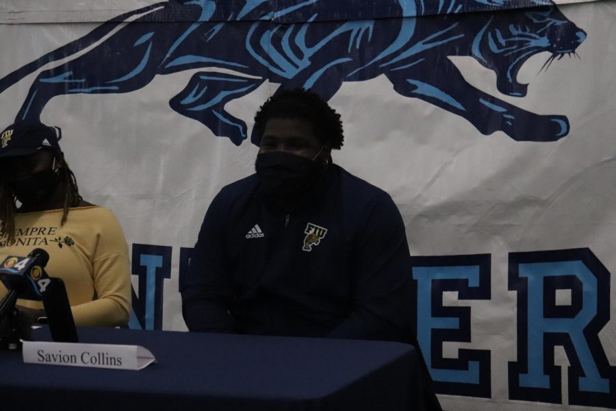 Collins beams as he shows off his FIU gear right after officially committing. 