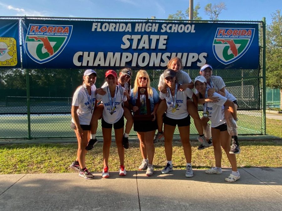 Mrs.Gibson and the girls tennis team smiling with their states trophy.

Photo courtesy of Mia Sorrentino