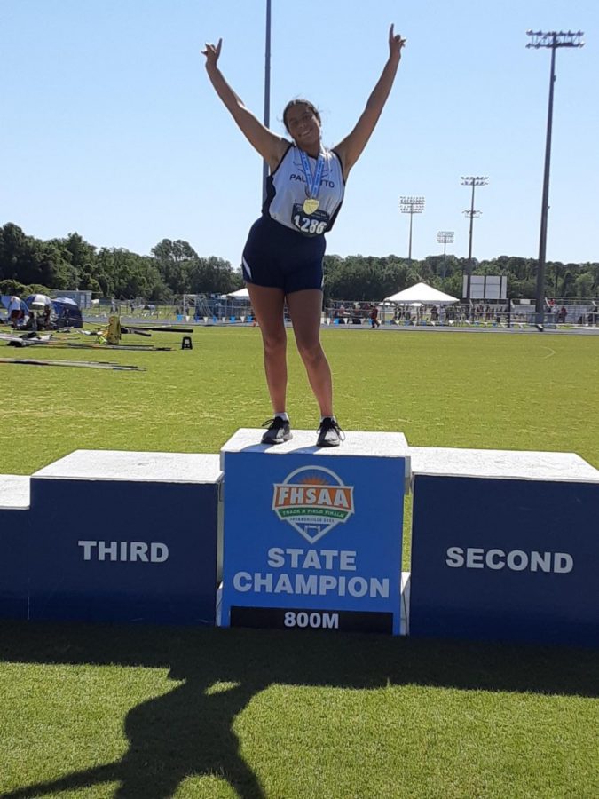 Sofia celebrates her success atop the state champion block.