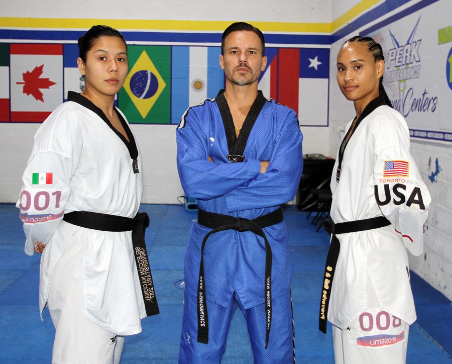 Briseida Acosta, Coach Juan Moreno, and Paige McPherson at the Peak Performance Miami training center.