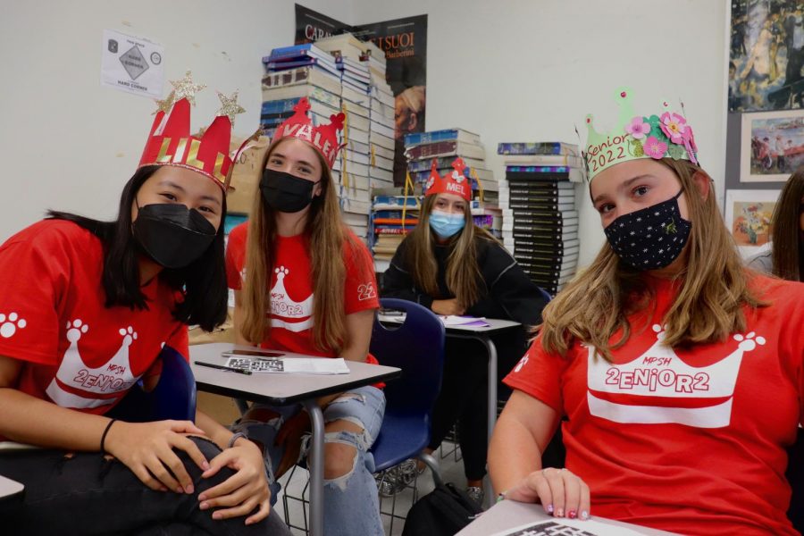 Four seniors show off their crowns during their AP Art History class.