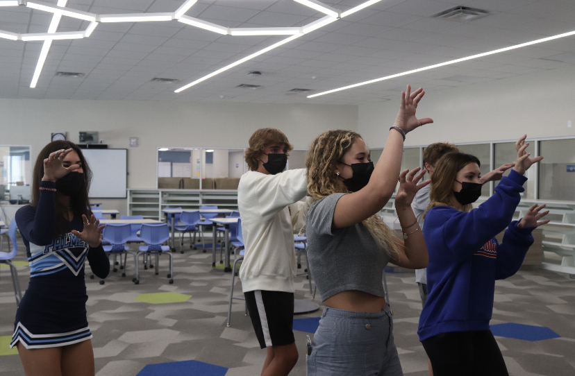 Sophmores Marly Young (front left), Stella Sharpe(front right), Travis Gettinger(back right), Ruben Behar(back center) and Mia Tamayo(back left) practicing dance routine for panther prowl.