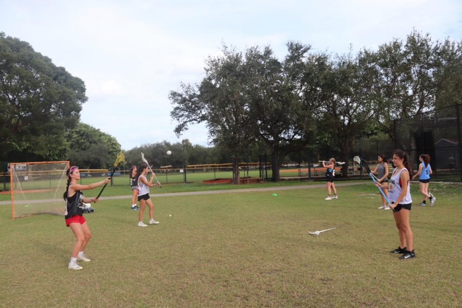The Palmetto Girl’s Lacrosse team practicing during preseason.