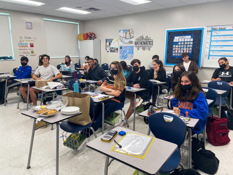 Students in Mrs. Quintela’s class working on their daily math assignment while enjoying some pie on national Pi Day.