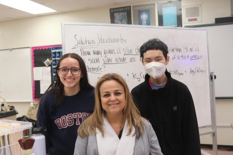 Sophomores Sunny You and Isabel Duran smile with AP Chemistry teacher Dr. Yuria Sharp as they have advanced to the National Chemistry Olympiad.