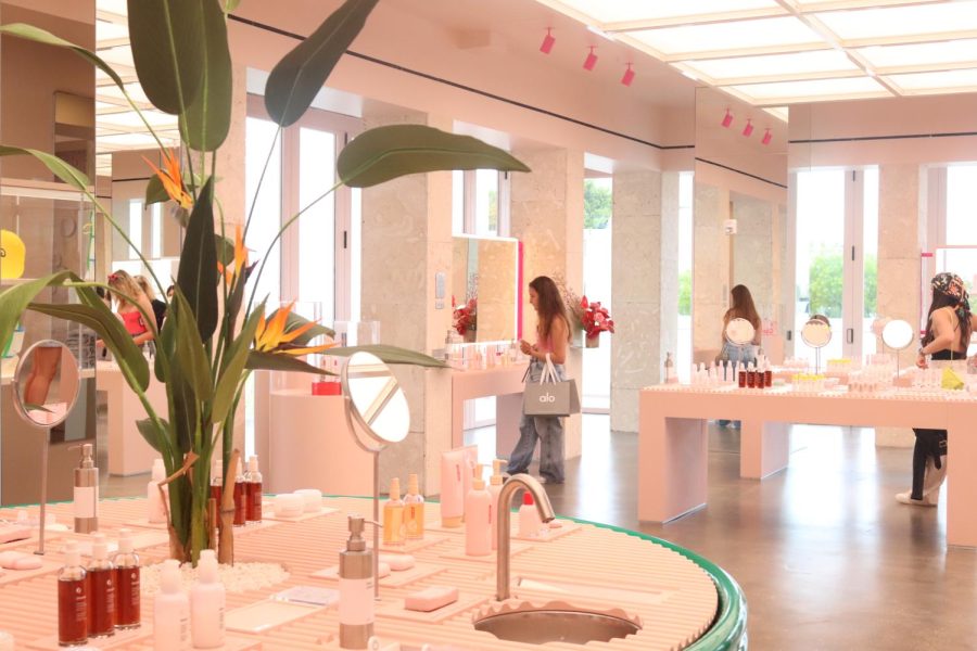 The new Glossier's tropical display of products.