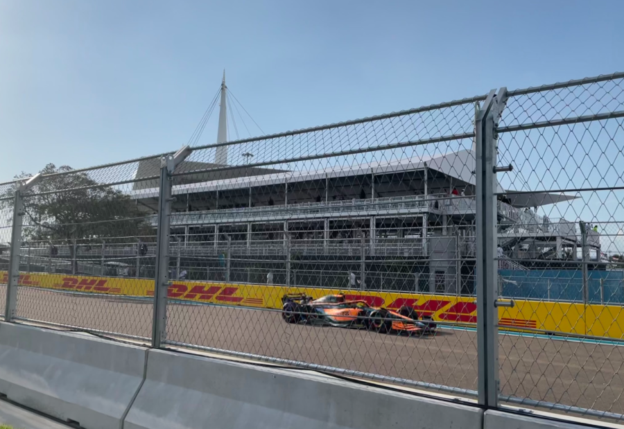 Daniel Ricciardo, driver for McLarens F1 team, speeds toward the East campus during a practice round.