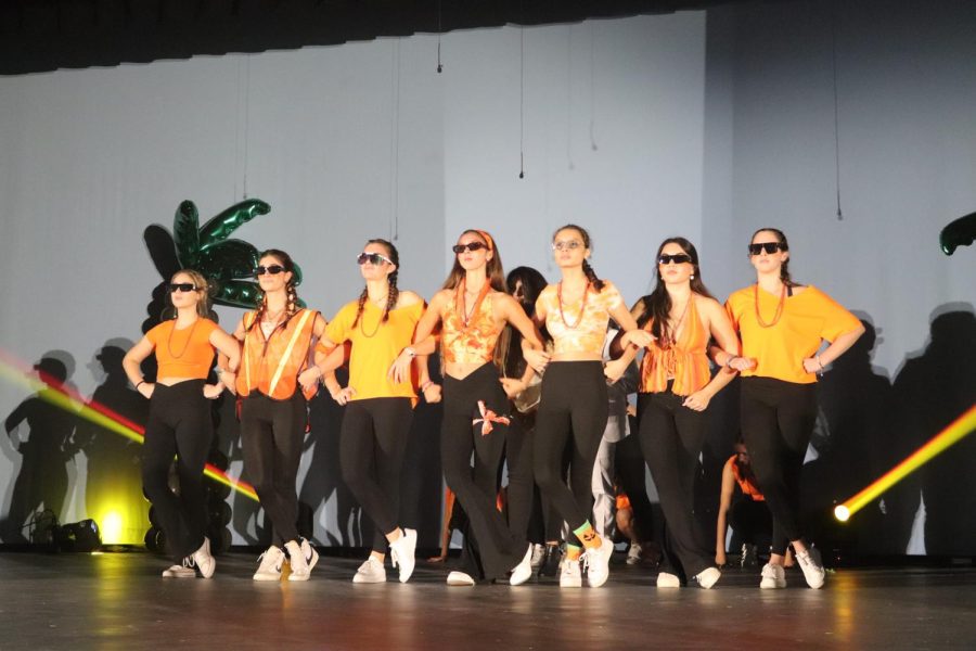The class of 2024 started their performance with sunglasses, decked out in orange pride.