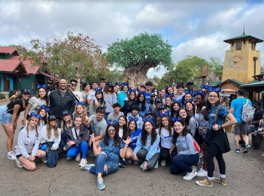 The class of 2024 poses for a photo in front of the Tree of Life.